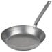 A Vollrath carbon steel frying pan with a handle.