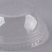 A clear plastic Fabri-Kal squat cup lid with a hole in the top.