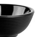 A close-up of a black Tablecraft melamine ramekin with ribbed sides.
