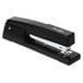 A Swingline black metal stapler.