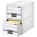A white file cabinet with blue drawers.