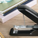 A black Swingline stapler on a table.