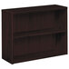 A HON mahogany wood bookcase with two shelves.