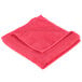A red Unger SmartColor Microfiber cleaning cloth folded on a white background.