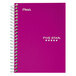 A purple spiral notebook with white writing on the cover.