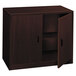 A dark brown HON 10500 Series laminate wood storage cabinet with two doors.