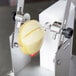 A Tellier MLT manual tourne vegetable cutter with a potato being squeezed into it.