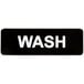 A black sign with white letters that says "Wash"