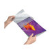 A person using a Fellowes purple and orange laminating pouch to laminate a purple sheet of paper.