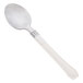 A white plastic teaspoon with a silver stainless steel look handle.