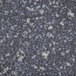 A close-up of a black and white speckled marbled surface.
