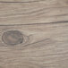 A Thunder Group Sequoia faux wood melamine serving board with a handle on a table.