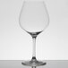 A clear Chef & Sommelier Cabernet wine glass on a white surface.