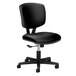 A close up of a HON Volt black leather office chair with a black seat and black base.