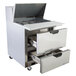 A stainless steel Beverage-Air refrigerated food prep table with open drawers.