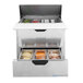A Beverage-Air stainless steel refrigerated sandwich prep table with food trays in containers.