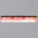 A close up of a red and white Taylor TempRite dishwasher test label with black text.