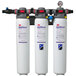 3 white water filters with red and black labels in a white container.