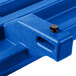 A navy blue plastic tray rail with a screw.