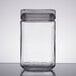 An Anchor Hocking clear glass jar with a black lid.