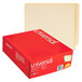 A red box of Universal letter size file folders with white text on the front.