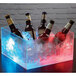 Clipper Mill LED light in a plastic container with beer bottles and ice.