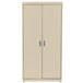 A tan metal HON storage cabinet with silver handles on the doors.