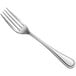 An Acopa Edgeworth stainless steel table fork with a silver handle.