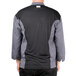 A man wearing a black and grey Chef Revival long sleeve chef jacket with mesh back.