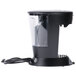 A black Bunn MCP My Cafe single cup coffee maker on a counter with a clear plastic cover.