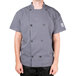 A man wearing a Chef Revival gray short sleeve chef jacket with mesh back.