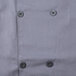 A close up of a buttoned gray Chef Revival short sleeve chef jacket.
