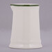 A white rectangular Tuxton China creamer with a green band on the top.