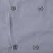 A close up of a gray Chef Revival long sleeve chef jacket with buttons.