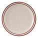 A white Tuxton china plate with brown speckled narrow rim.