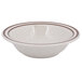 A white bowl with brown speckled wide rim.