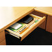 A HON Harvest laminate angled center drawer open with stationery in it.