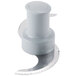 A grey serrated food processor blade with a circular shape and a handle.