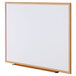 A Universal white melamine dry-erase board with a wooden frame.