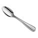 An Acopa Edgewood stainless steel demitasse spoon with a silver handle and spoon.