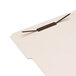 A white file folder with Universal self-adhesive paper fasteners in black.