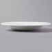 A close up of a Libbey Basics Orbis bright white porcelain pasta bowl with a rim.
