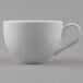 A Libbey bright white porcelain low cup with a handle.