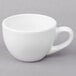 A close-up of a Libbey white porcelain espresso cup with a handle.
