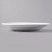 A close up of a Libbey bright white porcelain entree/pasta bowl with a rim.