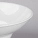 A close up of a Libbey white bowl with a white rim.