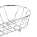 A Clipper Mill chrome metal wire basket with handles.