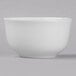 A Libbey bright white porcelain bouillon bowl on a gray surface.