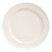 A close up of a white Libbey porcelain plate with swirls on the rim.