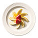 A Libbey bright white porcelain plate with sliced lemons and strawberries.